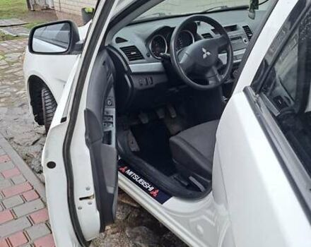 Белый Мицубиси Лансер, объемом двигателя 1.5 л и пробегом 160 тыс. км за 7600 $, фото 13 на Automoto.ua