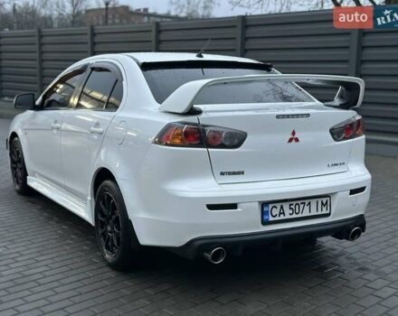 Білий Міцубісі Lancer, об'ємом двигуна 2 л та пробігом 225 тис. км за 7800 $, фото 5 на Automoto.ua