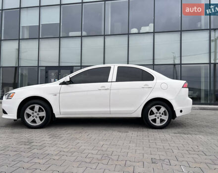 Белый Мицубиси Лансер, объемом двигателя 1.59 л и пробегом 145 тыс. км за 7500 $, фото 4 на Automoto.ua