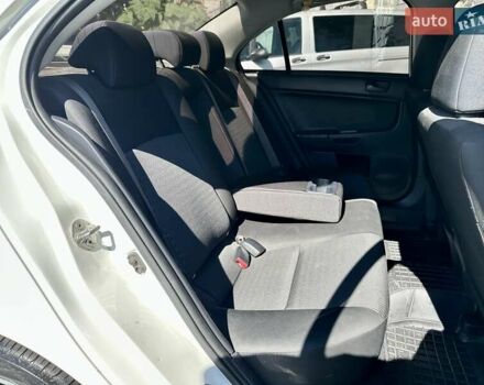 Белый Мицубиси Лансер, объемом двигателя 2 л и пробегом 124 тыс. км за 7700 $, фото 8 на Automoto.ua