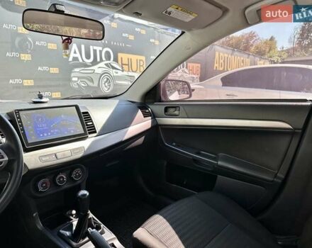 Белый Мицубиси Лансер, объемом двигателя 2 л и пробегом 124 тыс. км за 7700 $, фото 12 на Automoto.ua