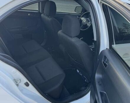 Білий Міцубісі Lancer, об'ємом двигуна 1.6 л та пробігом 180 тис. км за 7500 $, фото 4 на Automoto.ua