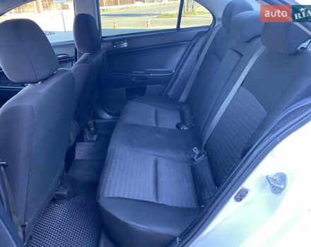 Білий Міцубісі Lancer, об'ємом двигуна 1.6 л та пробігом 205 тис. км за 4750 $, фото 27 на Automoto.ua