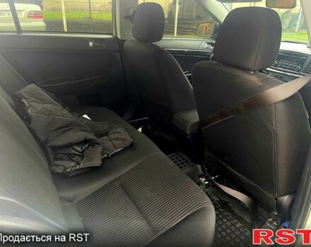 Білий Міцубісі Lancer, об'ємом двигуна 1.6 л та пробігом 162 тис. км за 6500 $, фото 8 на Automoto.ua