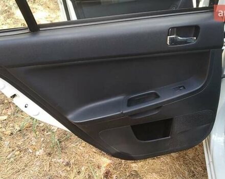 Білий Міцубісі Lancer, об'ємом двигуна 1.6 л та пробігом 155 тис. км за 9000 $, фото 7 на Automoto.ua