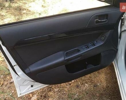 Білий Міцубісі Lancer, об'ємом двигуна 1.6 л та пробігом 155 тис. км за 9000 $, фото 11 на Automoto.ua