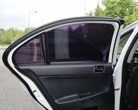 Белый Мицубиси Лансер, объемом двигателя 1.59 л и пробегом 130 тыс. км за 8500 $, фото 43 на Automoto.ua