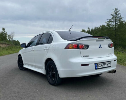 Білий Міцубісі Lancer, об'ємом двигуна 2 л та пробігом 208 тис. км за 8700 $, фото 12 на Automoto.ua