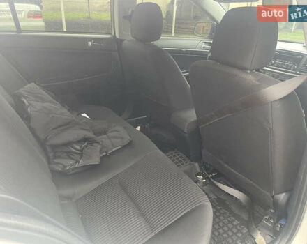 Белый Мицубиси Лансер, объемом двигателя 1.59 л и пробегом 163 тыс. км за 6700 $, фото 1 на Automoto.ua