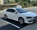 Белый Мицубиси Лансер, объемом двигателя 2 л и пробегом 210 тыс. км за 9700 $, фото 1 на Automoto.ua