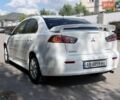Білий Міцубісі Lancer, об'ємом двигуна 2 л та пробігом 135 тис. км за 8400 $, фото 1 на Automoto.ua