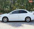 Білий Міцубісі Lancer, об'ємом двигуна 2 л та пробігом 135 тис. км за 8400 $, фото 15 на Automoto.ua