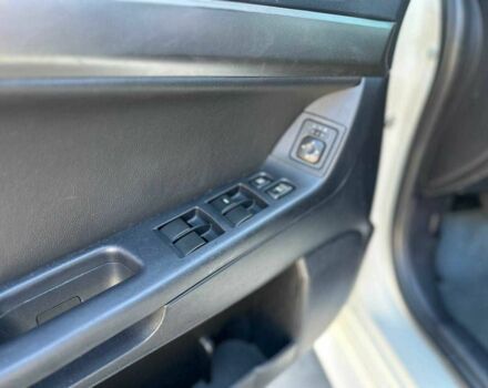 Белый Мицубиси Лансер, объемом двигателя 2 л и пробегом 113 тыс. км за 8500 $, фото 9 на Automoto.ua