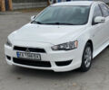 Білий Міцубісі Lancer, об'ємом двигуна 2 л та пробігом 230 тис. км за 8600 $, фото 1 на Automoto.ua