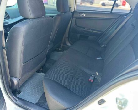 Белый Мицубиси Лансер, объемом двигателя 2 л и пробегом 113 тыс. км за 8500 $, фото 5 на Automoto.ua