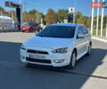 Білий Міцубісі Lancer, об'ємом двигуна 2 л та пробігом 165 тис. км за 7899 $, фото 2 на Automoto.ua