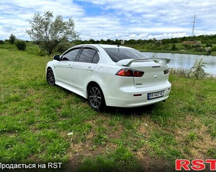 Белый Мицубиси Лансер, объемом двигателя 2 л и пробегом 100 тыс. км за 8750 $, фото 5 на Automoto.ua