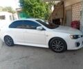 Білий Міцубісі Lancer, об'ємом двигуна 2 л та пробігом 115 тис. км за 10087 $, фото 1 на Automoto.ua