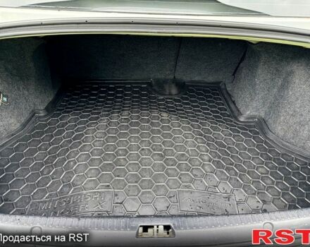 Белый Мицубиси Лансер, объемом двигателя 2 л и пробегом 100 тыс. км за 8750 $, фото 7 на Automoto.ua