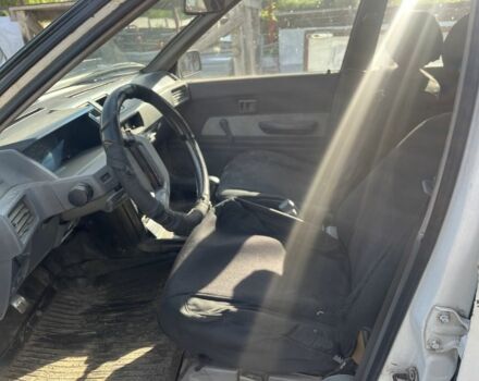 Білий Міцубісі Lancer, об'ємом двигуна 1.9 л та пробігом 438 тис. км за 463 $, фото 9 на Automoto.ua