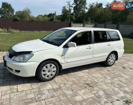 Білий Міцубісі Lancer, об'ємом двигуна 1.6 л та пробігом 147 тис. км за 3100 $, фото 1 на Automoto.ua