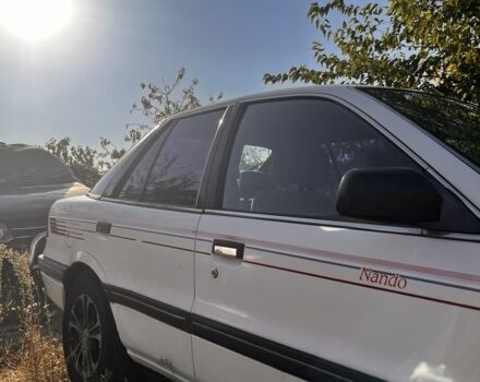 Білий Міцубісі Lancer, об'ємом двигуна 1.8 л та пробігом 350 тис. км за 2100 $, фото 6 на Automoto.ua