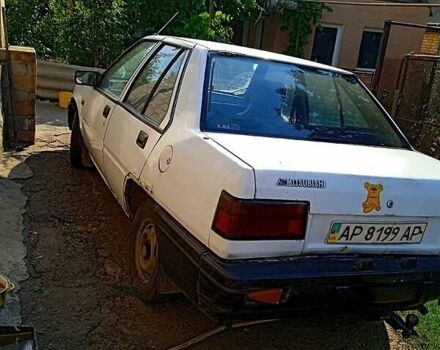 Білий Міцубісі Lancer, об'ємом двигуна 1.8 л та пробігом 270 тис. км за 520 $, фото 1 на Automoto.ua