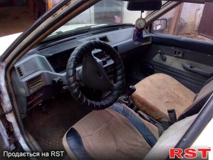 Білий Міцубісі Lancer, об'ємом двигуна 1.5 л та пробігом 290 тис. км за 1200 $, фото 1 на Automoto.ua