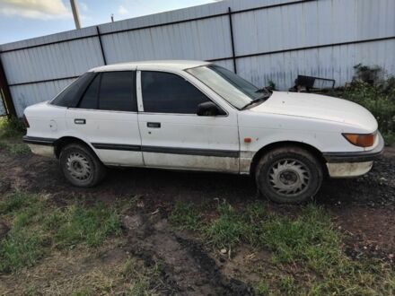 Белый Мицубиси Лансер, объемом двигателя 1.8 л и пробегом 86 тыс. км за 700 $, фото 1 на Automoto.ua