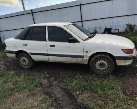 Білий Міцубісі Lancer, об'ємом двигуна 1.8 л та пробігом 86 тис. км за 700 $, фото 1 на Automoto.ua