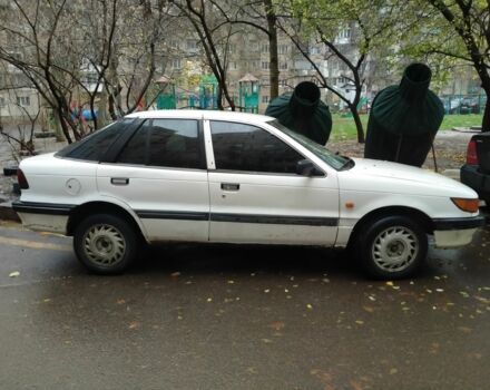 Белый Мицубиси Лансер, объемом двигателя 1.8 л и пробегом 86 тыс. км за 750 $, фото 1 на Automoto.ua