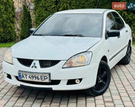 Білий Міцубісі Lancer, об'ємом двигуна 1.58 л та пробігом 330 тис. км за 2850 $, фото 1 на Automoto.ua