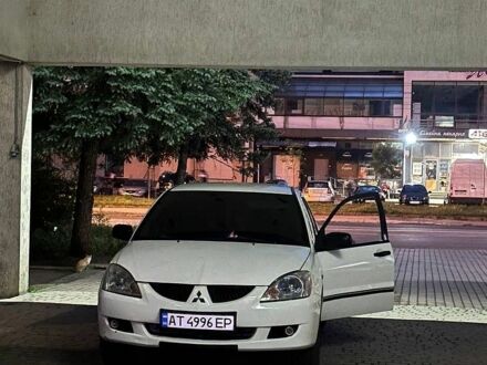 Білий Міцубісі Lancer, об'ємом двигуна 1.58 л та пробігом 300 тис. км за 1300 $, фото 1 на Automoto.ua