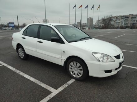 Белый Мицубиси Лансер, объемом двигателя 1.6 л и пробегом 306 тыс. км за 3000 $, фото 1 на Automoto.ua