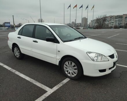 Белый Мицубиси Лансер, объемом двигателя 1.6 л и пробегом 306 тыс. км за 3000 $, фото 1 на Automoto.ua