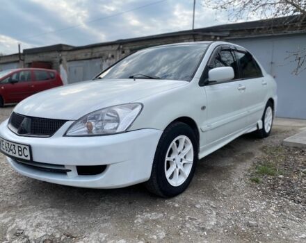 Белый Мицубиси Лансер, объемом двигателя 1.6 л и пробегом 200 тыс. км за 3000 $, фото 1 на Automoto.ua