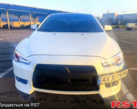 Белый Мицубиси Лансер, объемом двигателя 2 л и пробегом 172 тыс. км за 7350 $, фото 1 на Automoto.ua