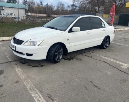 Білий Міцубісі Lancer, об'ємом двигуна 1.6 л та пробігом 221 тис. км за 4500 $, фото 1 на Automoto.ua