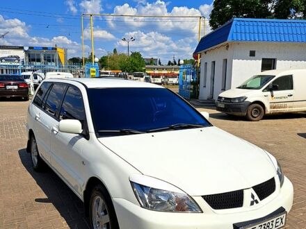 Білий Міцубісі Lancer, об'ємом двигуна 1.6 л та пробігом 200 тис. км за 5500 $, фото 1 на Automoto.ua