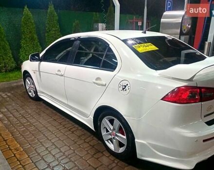 Белый Мицубиси Лансер, объемом двигателя 2 л и пробегом 254 тыс. км за 5850 $, фото 1 на Automoto.ua