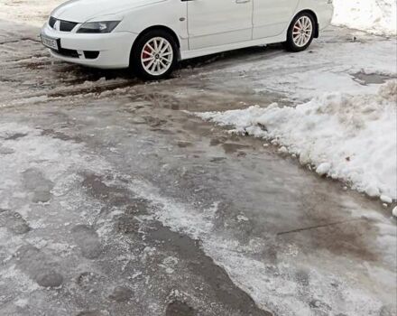 Білий Міцубісі Lancer, об'ємом двигуна 1.59 л та пробігом 221 тис. км за 5250 $, фото 1 на Automoto.ua