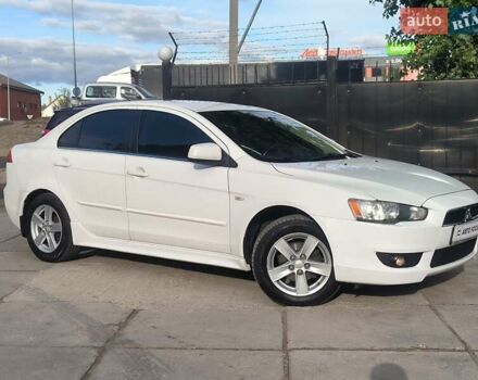 Білий Міцубісі Lancer, об'ємом двигуна 2 л та пробігом 170 тис. км за 7490 $, фото 1 на Automoto.ua