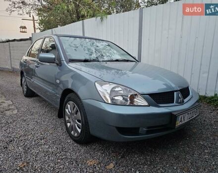 Білий Міцубісі Lancer, об'ємом двигуна 1.6 л та пробігом 59 тис. км за 6700 $, фото 1 на Automoto.ua
