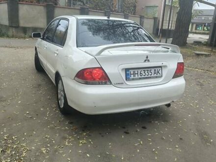 Белый Мицубиси Лансер, объемом двигателя 1.59 л и пробегом 222 тыс. км за 4950 $, фото 1 на Automoto.ua
