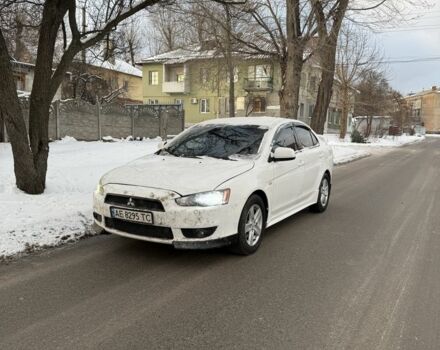Белый Мицубиси Лансер, объемом двигателя 2 л и пробегом 207 тыс. км за 5750 $, фото 1 на Automoto.ua