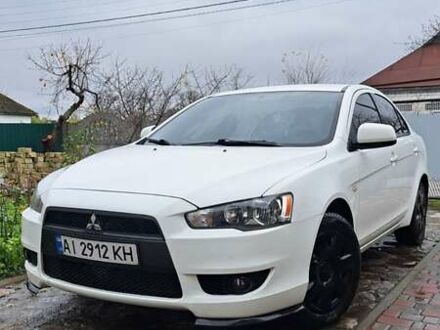 Белый Мицубиси Лансер, объемом двигателя 1.5 л и пробегом 160 тыс. км за 7600 $, фото 1 на Automoto.ua