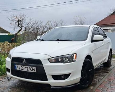 Білий Міцубісі Lancer, об'ємом двигуна 1.5 л та пробігом 160 тис. км за 7600 $, фото 1 на Automoto.ua