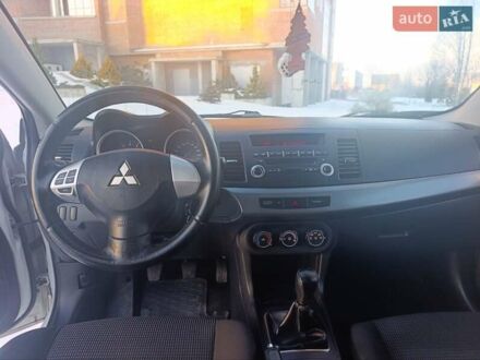 Белый Мицубиси Лансер, объемом двигателя 1.5 л и пробегом 163 тыс. км за 6550 $, фото 1 на Automoto.ua