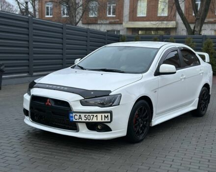 Белый Мицубиси Лансер, объемом двигателя 2 л и пробегом 225 тыс. км за 7800 $, фото 1 на Automoto.ua