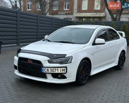 Белый Мицубиси Лансер, объемом двигателя 2 л и пробегом 225 тыс. км за 7800 $, фото 1 на Automoto.ua